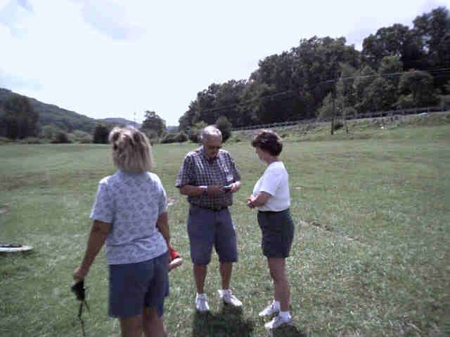 Elizabeth, Sam Sr. and Marcie discussing the events of the day.